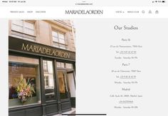 an image of a storefront with flowers in the window and on the website page