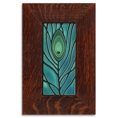 a wooden frame with a blue and green painting on the front, in an art nouveau style