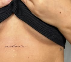 a woman's lower back with the word alot written on her left side