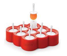 an orange and white cup holder with cups in it on top of a red tray