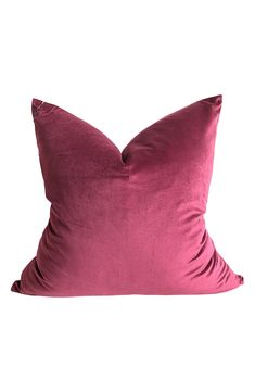 a pink pillow on a white background