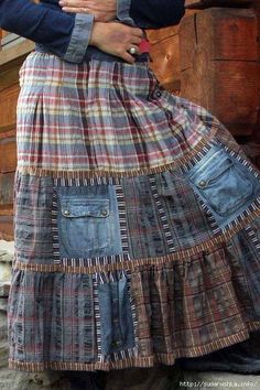 a woman wearing a skirt made out of old jeans