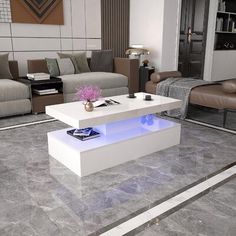 a living room filled with furniture and a white coffee table