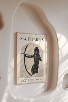 an advertisement for sagittarius hangs on the wall