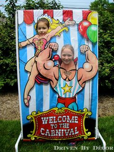 a child standing in front of a welcome to the carnival sign