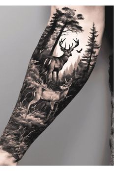 a man's arm with an image of deer in the woods and trees on it