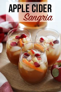 apple cider sangria with apples and cranberries in glasses on a cutting board