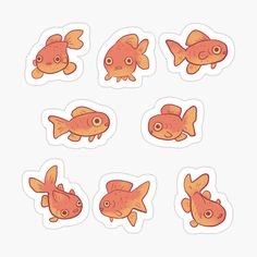 six goldfish stickers with different shapes and sizes on them, all in orange