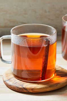 a cup of tea with cinnamon sticks in it