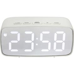 an alarm clock with the time displayed on it's display screen and two hands