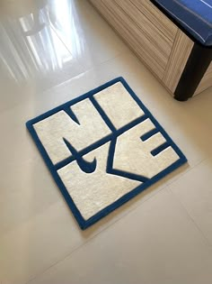 a blue and white area rug on the floor