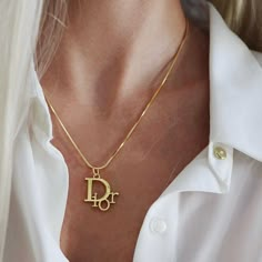 Repurposed authentic Christian Dior pendant on a gold filled chain. Shop our selection of authenticated luxury designer jewelry at affordable prices. Christian Dior Logo, Dope Jewelry Accessories, Dior Gold, Dior Necklace, Logo Necklace, Dior Logo, Vintage Charm Bracelet, Dior Jewelry