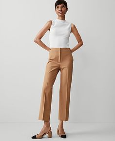 Elevate your wardrobe with the Ann Taylor Button Pencil Pant in Twill, a testament to sophistication and comfort. Perfectly tailored to flatter, these pants feature a high-rise, slim leg that hits just at the ankle, ensuring a sleek silhouette.

- Size: 4 Regular
- Color: Perfect Camel
- Material: 54% Viscose, 39% Cotton, 7% Lyocell
- Gender: Female
- Fit: Tailored and fitted
- Length: Ankle-length with a 28" inseam and 17 1/2" leg opening
- Features: Front zip with double hook-and-bar closure, Women’s Work Pants, Camel Colored Pants Outfit, Pants For Petite Women, Camel Pants Outfit, Business Fits, Camel Pants, Pencil Pant, Sequin Pencil Skirt, Work Pants Women