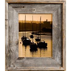 an old wooden frame with boats in the water