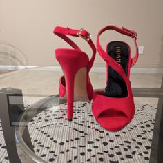 Red Heels New Never Worn Chic Red Sandals For Night Out, Red Round Toe Sandals For Night Out, Red Sandals With Heel Strap For Night Out, Red Open Toe Heels With 4-inch Heel, Chic Red Heels With 4-inch Heel, Red Heels With Padded Heel And Ankle Strap, Red Heels With Wrapped Heel And Ankle Strap, Red High Heels With Heel Strap, Red Heels With Heel Strap For Night Out