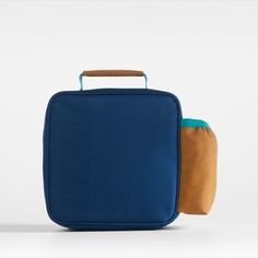 A fun and functional lunch box that's built to handle all the thrills and spills of the day. Combining colorblocks of navy and ocher with pops of aqua trim, our bag is constructed of food-safe and supremely durable polyester made from recycled water bottles. It's also lightweight and easy to clean, plus roomy enough to hold multiple storage containers. An insulated lining keeps meals just the way your kid likes them—hot, cold or somewhere in between. An outer pocket safely stows a napkin, utensi Blue Rectangular Lunch Box For Daily Use, Blue Rectangular Lunch Bag For Daily Use, Blue Functional Lunch Bag For Everyday Use, Functional Blue Lunch Bag For Everyday Use, Functional Blue Lunch Bag, Functional Rectangular Lunch Bag For Back To School, Blue Lunch Bag For Back To School, Blue Rectangular Lunch Box, Functional Blue Rectangular Lunch Bag