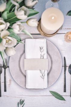 an elegant table setting with white flowers and candles stock photo