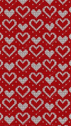 a red and white knitted pattern with hearts on the front, in two rows