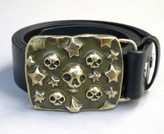 "Recently created in my new artist-blacksmithing studio near Berkeley Springs, WV! Here's one that will stand out and make a statement! Skulls and stars will even keep the Zombies away! So, what are your likes and desires? This buckle will make a statement for and about you. Also great as a side buckle! This hot forged solid bronze belt buckle was made from a bar of bronze that was hammered and squished using hand hammer and anvil and a home made 60 ton hydraulic forging press. I made of all of Berkeley Springs Wv, Skull Belt Buckle, The Zombies, Anvils, Couple Fits, Handmade Stamps, String Bag, New Rock, Cool Fits