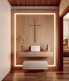 a room with a bench and a cross on the wall