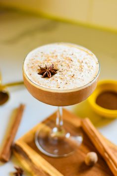 a drink with cinnamon and anise on the rim