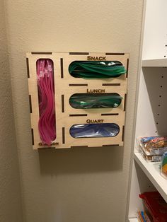 a wooden rack with skateboards mounted to it