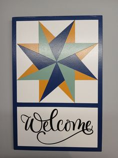 a welcome sign with a star on the front and words below it that read, welcome