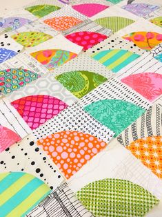 the colorful quilt has many different designs on it