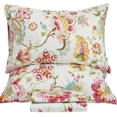 an image of a bed set with flowers and butterflies on the pillow cover, sheets and pillows