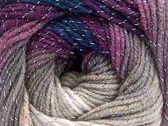 several skeins of yarn with white and purple speckles