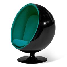 a black and blue ball chair sitting on top of a table