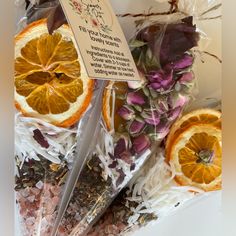 an assortment of dried fruits and flowers on display