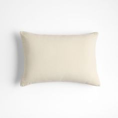 a white pillow on a white wall