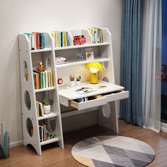 a child's desk with bookshelf and shelves in front of a window