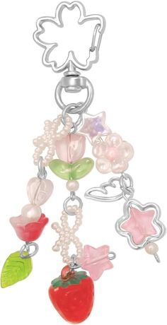 a key chain with charms attached to it's ends and an apple hanging from the end