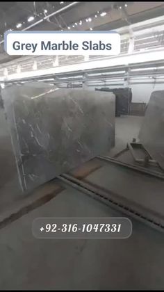 there are many marble slabs in the warehouse