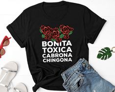 Bonita toxica Cabrona Chingona Shirt, Latina T Shirts, Latina Feminist Shirt, Spanish Shirt, Mexicana Shirt, Bonita Toxica Shirt Cabrona CHOOSING A SIZE: * Please see the size charts in the listing images. Measure twice, ship once! * Our unisex tees look great on men and women! * Questions? Contact us. APPAREL QUALITY: * All of our apparel is pre-shrunk. * Our prints are made to last for years via direct-to-garment (DTG) printing technology. FREQUENTLY ASKED QUESTIONS: * We can make customizatio Chingona Shirt, Halloween Pregnancy Shirt, Spanish Shirts, Sweet Shirt, Feminist Shirt, Pregnancy Shirts, Dtg Printing, Size Charts, Kids Tops