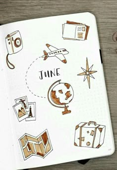 an open notebook with travel stickers on it and the words june written in black ink