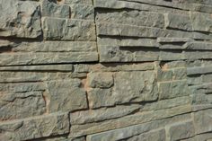 a stone wall made out of different types of rocks