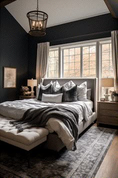 a large bed sitting under a window in a bedroom