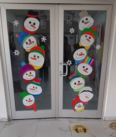 two frosted glass doors with snowmen on them