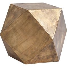 an octagonal wooden object with gold paint on it