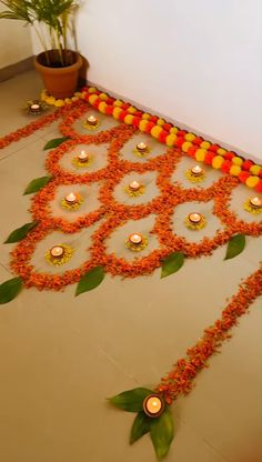 a decorated floor with candles and flowers on it