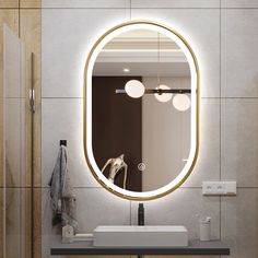 a bathroom with a sink, mirror and lights on the wall in front of it