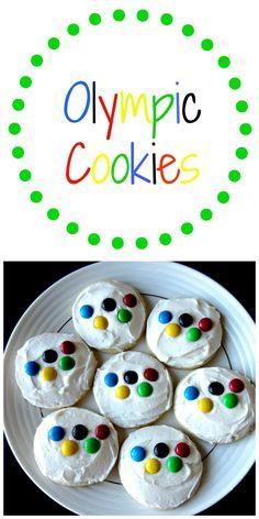 the olympic cookies are decorated with white frosting and colorful candies on top of them