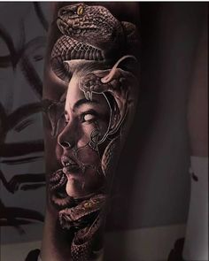 a woman with a snake on her head is shown in black and white tattoo art