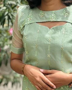 E- 980 green thread work organza kurti with elbow sleevs (with lining ) Sizes: XS to XL Mild soap handwash and steam ironing is recommended Dm for orders and price Colour may slightly vary due to lighting Model Size -Xs [kurti, festive, maxi, co ord, kurta sets, regular wear, casual wear, office wear, style, marriage] #kurti#casulakurti#dailywearkurti#smallbusiness#officewearkurti#officewearstyle#kurtisofeyal#festivekurtis#kurtidesign#kurtis #kurticollection#kurtifashion#kurtistyle#eya... Chudithar Back Neck Design, Kurti Designs Neck Design, Thread Work Kurti, A Line Kurti Designs, Neck Line Design, Neck Designs For Kurtis, Long Skirt Top Designs