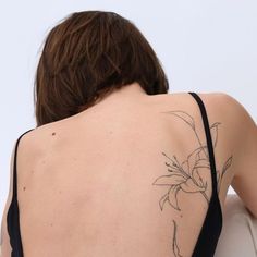 a woman with a tattoo on her back