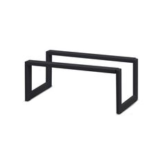 a black metal table with two legs on each side and one end in the shape of a rectangle