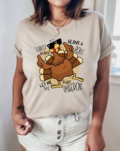 "Turkey Gravy Beans and Rolls Let Me See That Casserole Shirt, Turkey Lover Shirt, Family Thanksgiving Shirt, Thanksgiving Dinner Shirt, Fall PLEASE READ ORDERING INSTRUCTIONS BEFORE PURCHASINİNG \"CUSTOMIZATION\" If you are looking for a specific shirt style, design or color not offered in my store, please let me know. \"RETURNS / EXCHANGES\" Unfortunately, due to the customization of the shirts we are unable to accept returns or exchanges on merchandise. In case of dispute, the buyer pays the Turkey Lover, Cute Thanksgiving Outfits, Thanksgiving Outfits, Turkey Gravy, Family Thanksgiving, Thanksgiving Shirt, Shirt Printing, Thanksgiving Outfit, Thanksgiving Shirts